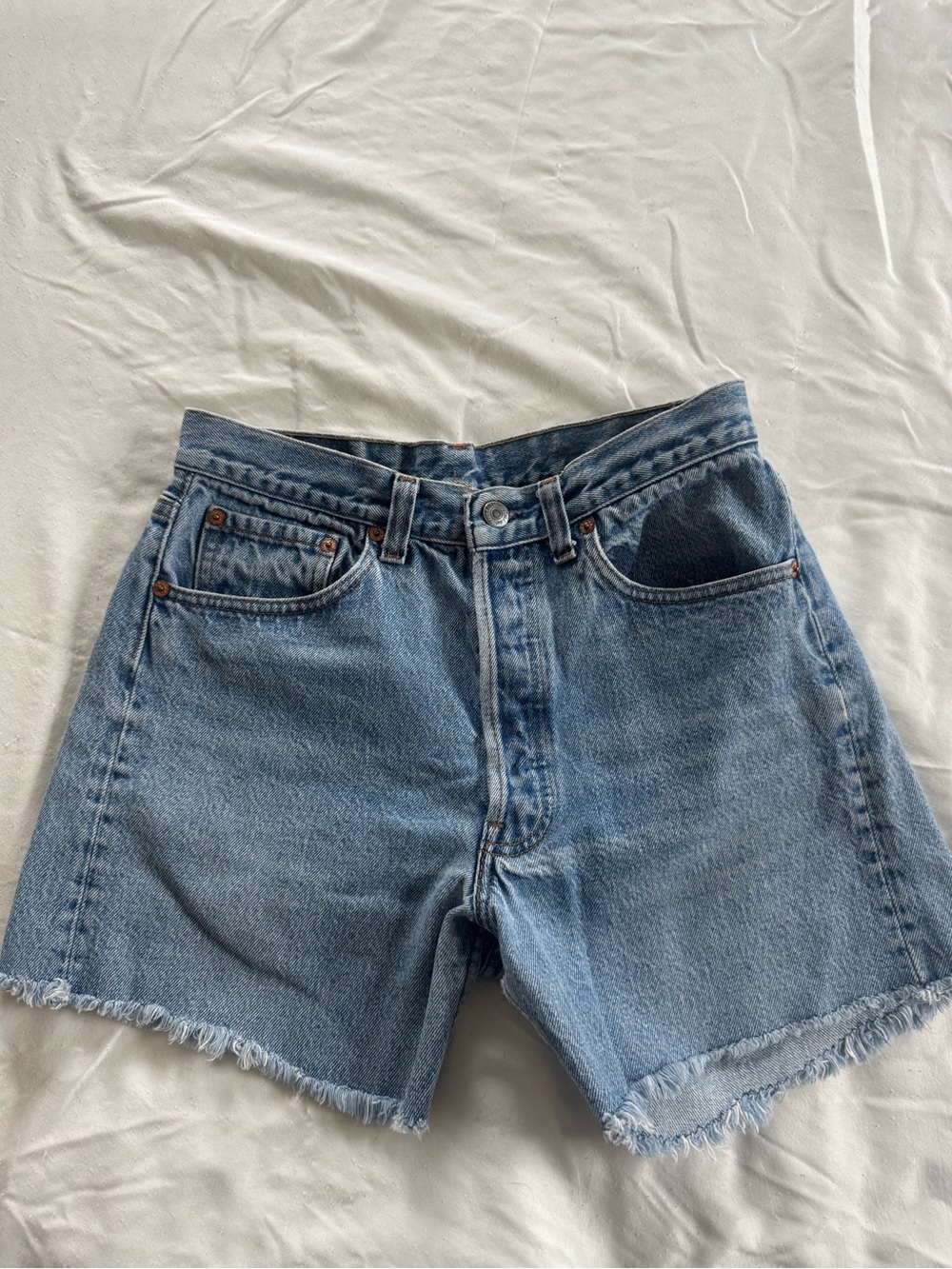 Classic Vintage Levi’s 501 cut-off shorts. Button fly, size 31.